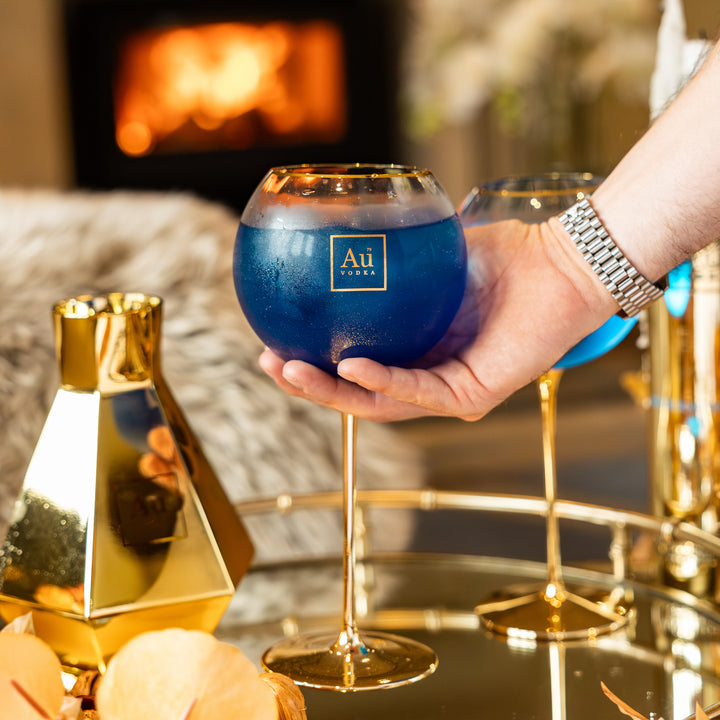 Verre à bulles à pied doré Au 
